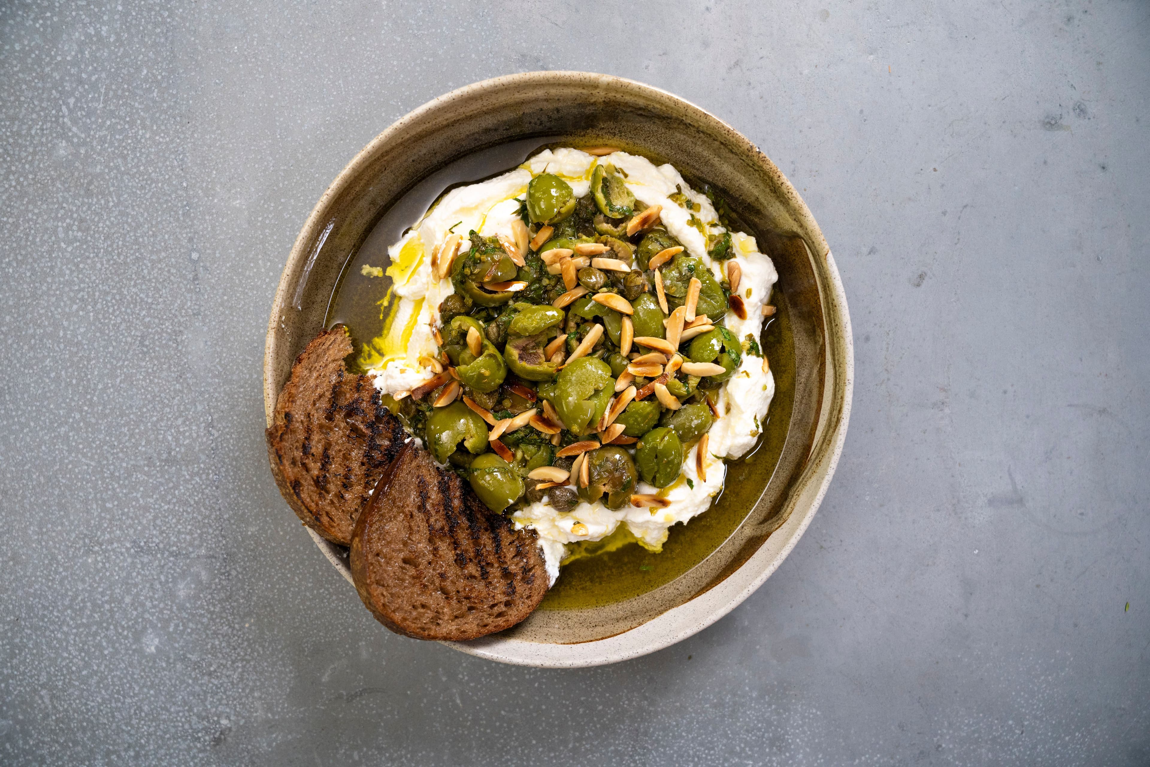 Ricotta with Crushed Olives, Almonds and Lemon