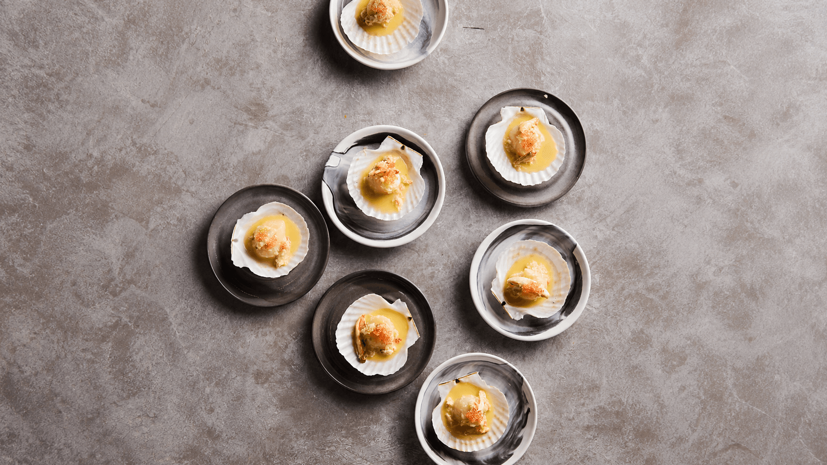 Poached Scallops with Crab Butter, Roasted Fish Sauce & Finger Lime