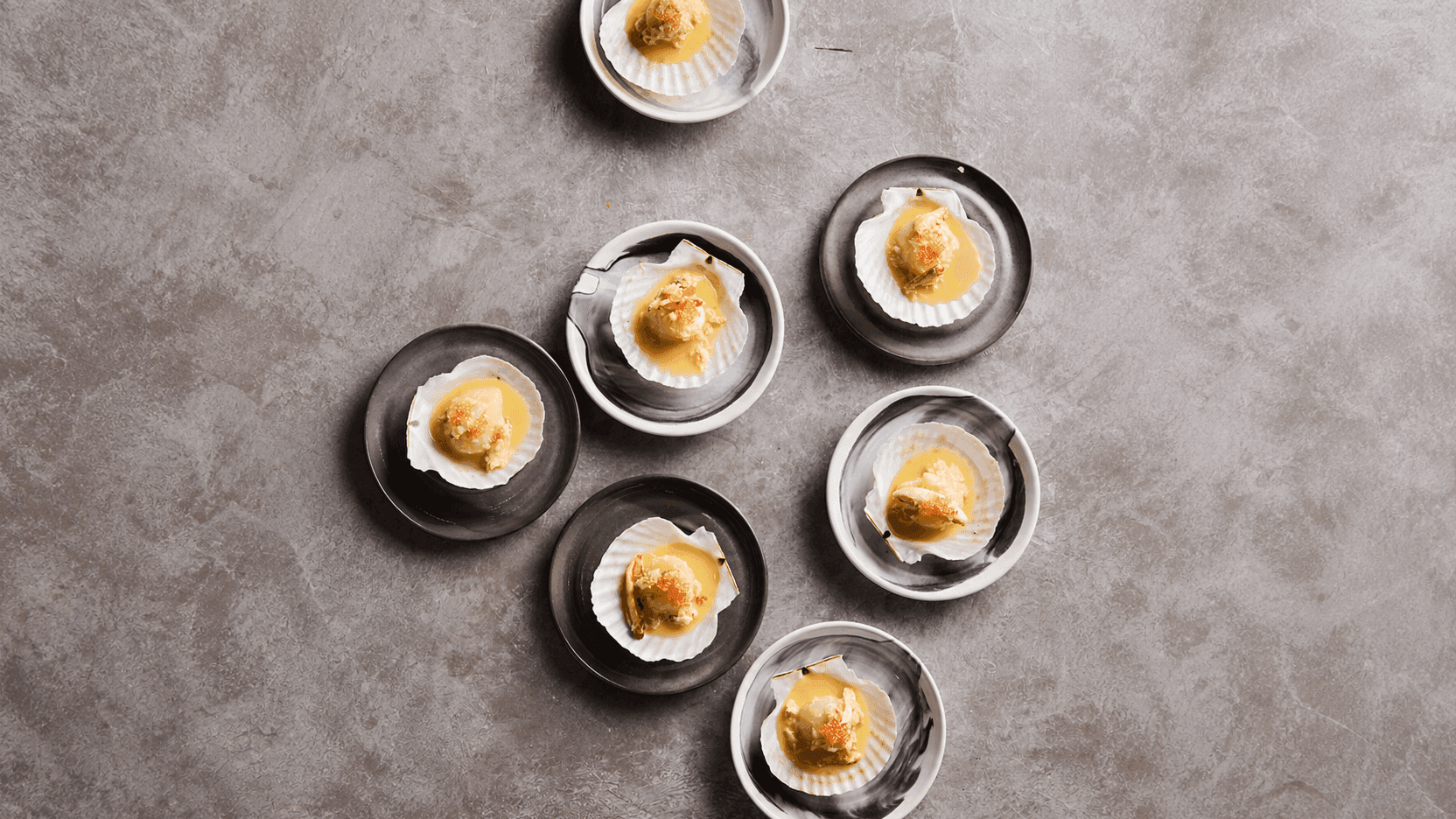 Poached Scallops with Crab Butter, Roasted Fish Sauce & Finger Lime