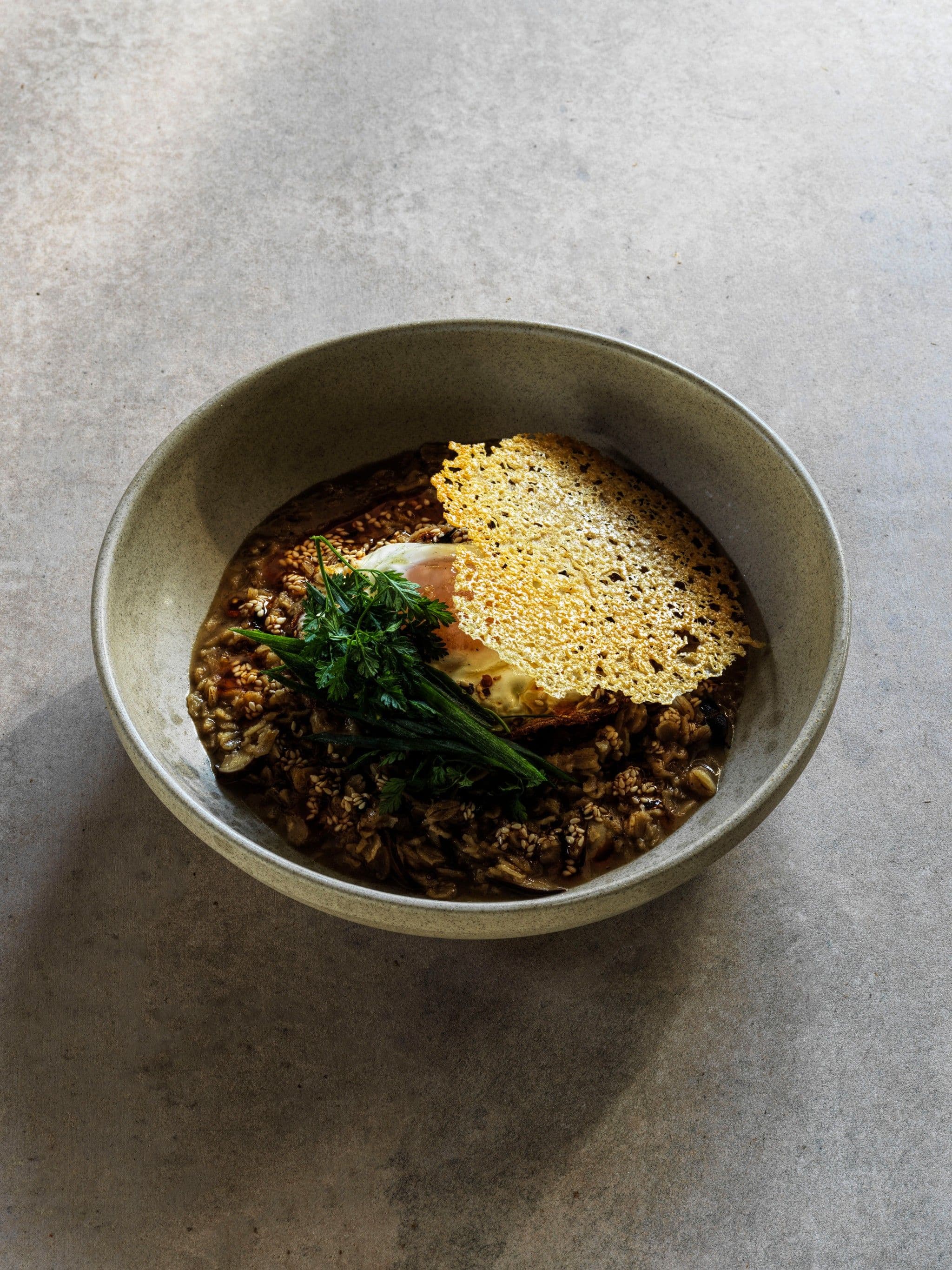 Savoury Porridge with Caramelised Onion, Shiitake, Fried Duck Egg, Chili & Crispy Parmesan recipe preview